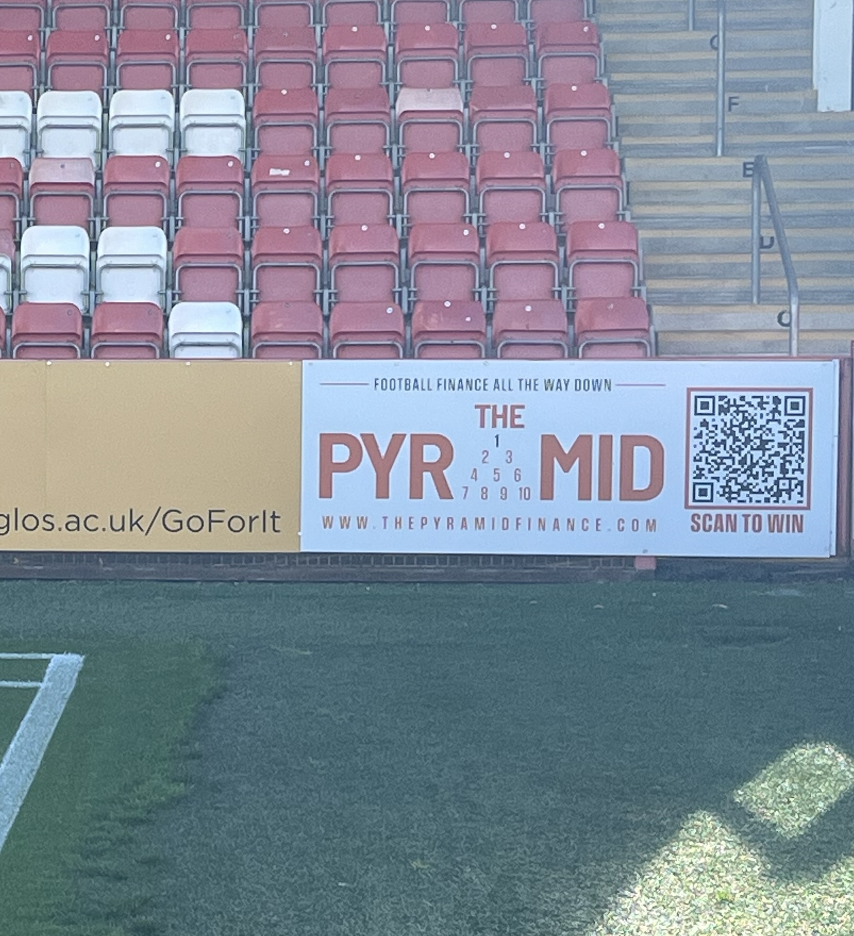 The Pyramid pitchside advertising board at Cheltenham Town's Whaddon Road
