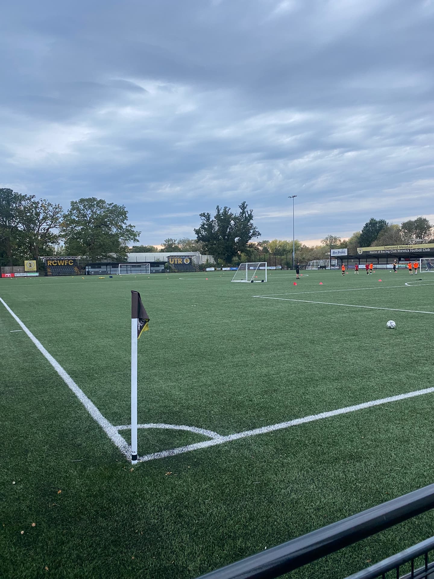 Townsend Meadow pitch and clubhouse during a matchday warm-up