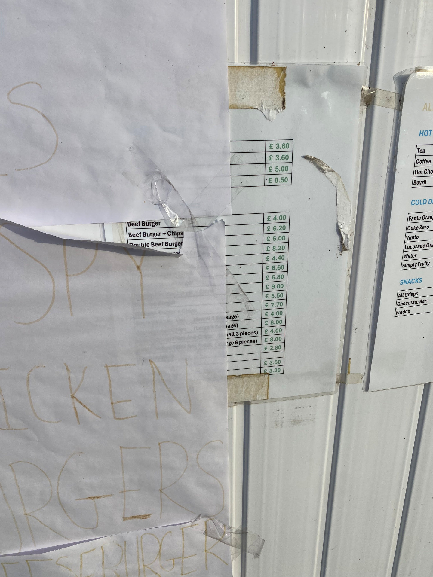 Taped price list at Pack Meadow listing Beef Burger £4.00, Beef Burger + Chips £6.20 and Double Beef Burger £6.00