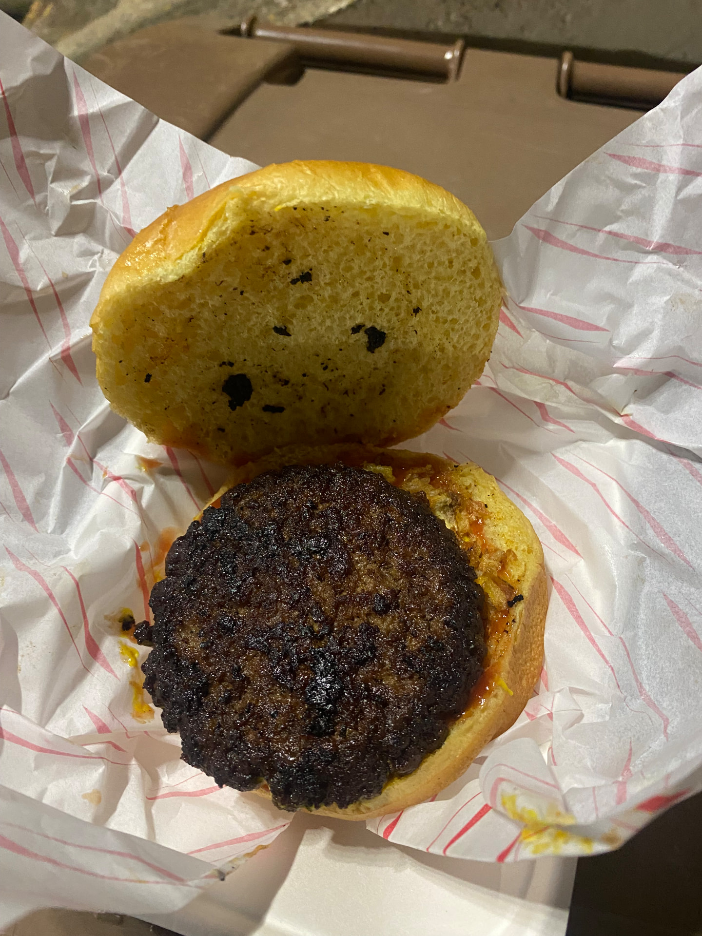 Sutton United's Classic Burger opened to show the heavily charred rib cap beef patty