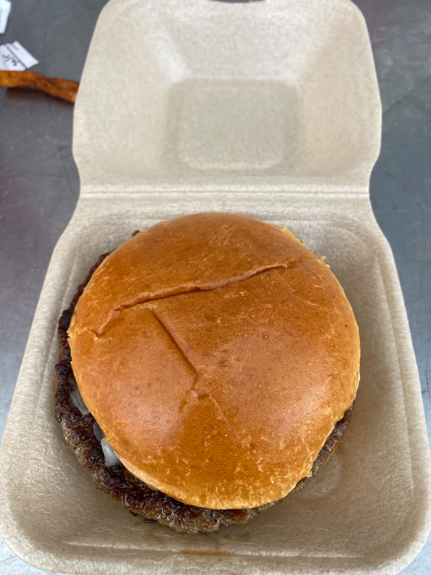 The closed Hampton & Richmond burger in its matchday tray